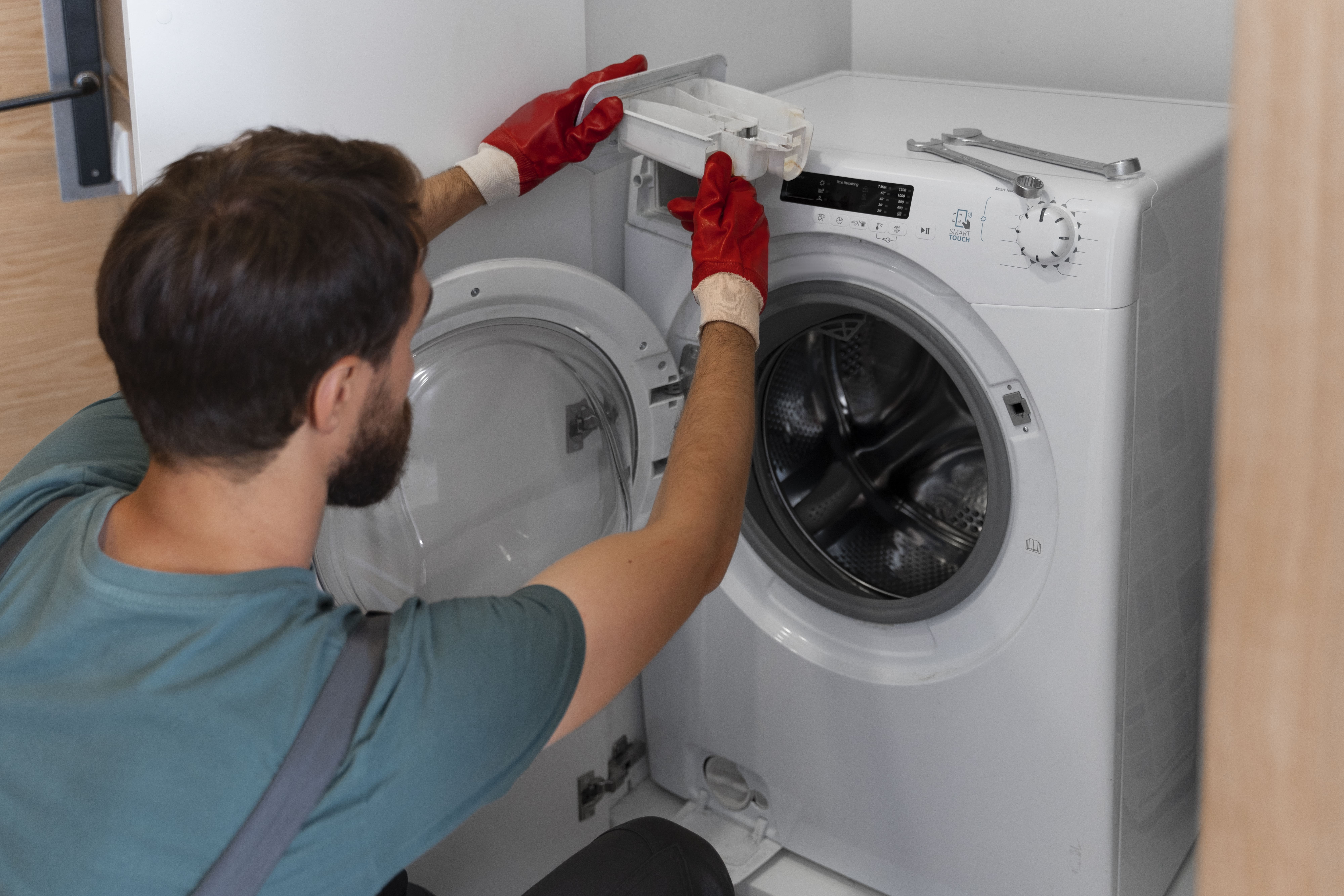 Professional Technician Repairing Washing Machine in Chennai - Home Appliance Care